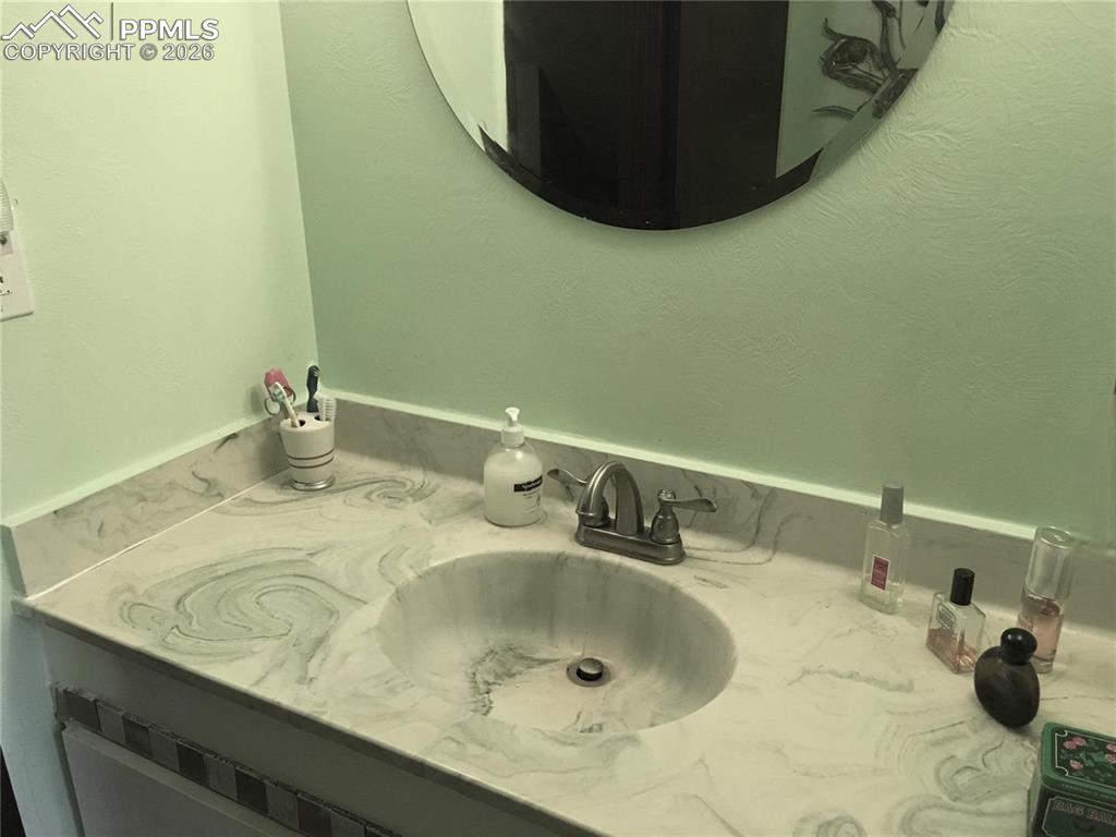 Lower level basement 1/2 bath/laundry area.