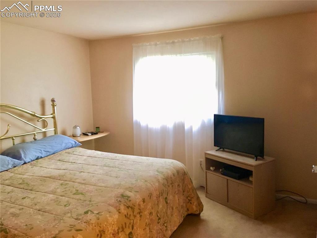 Upper level primary bedroom features a walk-in closet.
