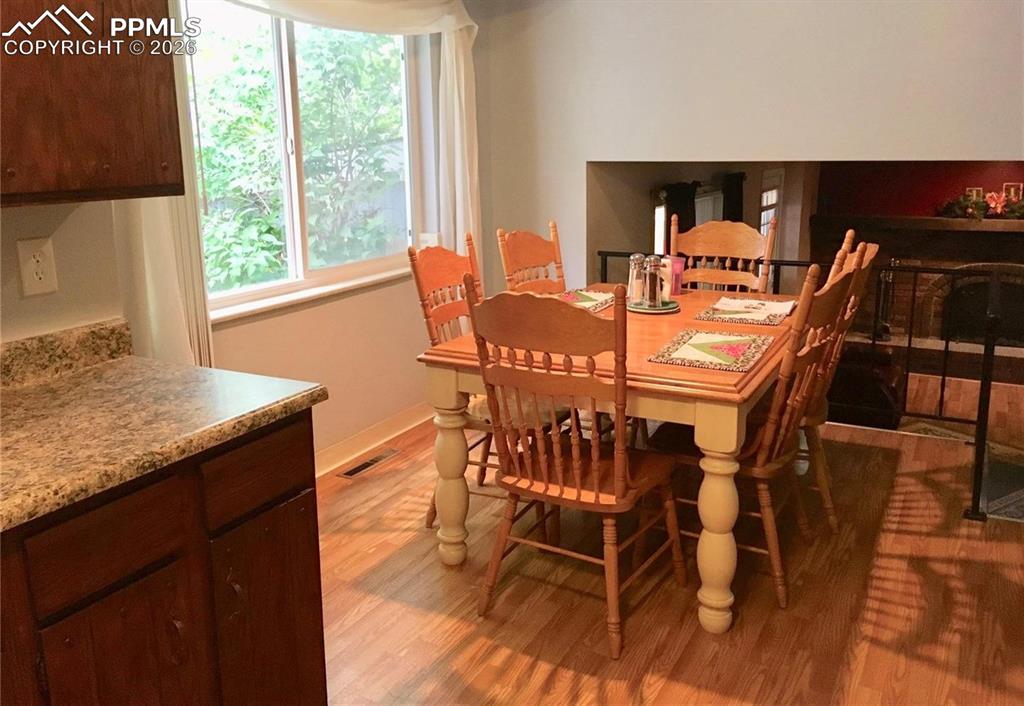 Bright dining area adjacent to kitchen.
