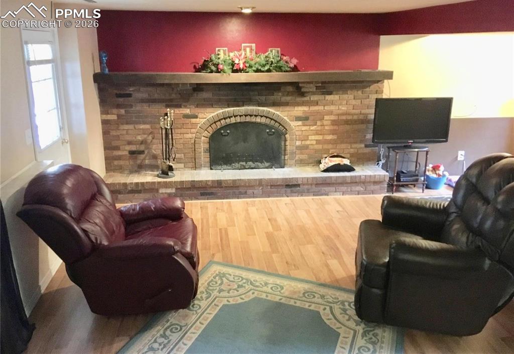 Beautiful wood-burning fireplace in lower level family room.