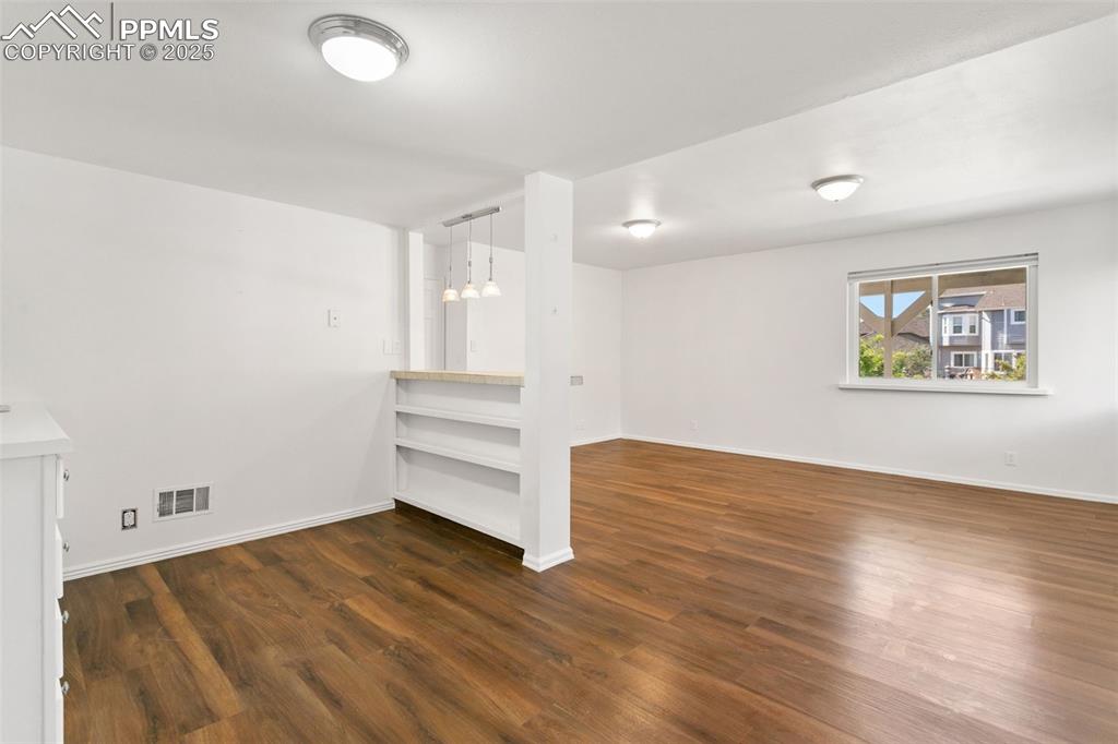 Spare room featuring wood finished floors