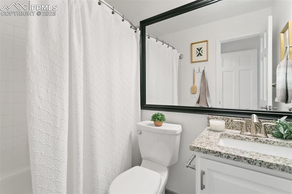 Bathroom with vanity and shower / bath combo