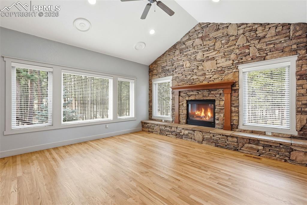 View of trees from Family Room/Den, which also boasts a ceiling fan, and a high ceilings