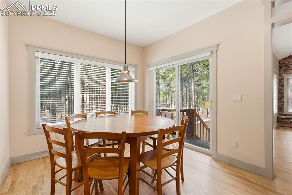 Dining room featuring oak wood flooring and baseboards and great windows