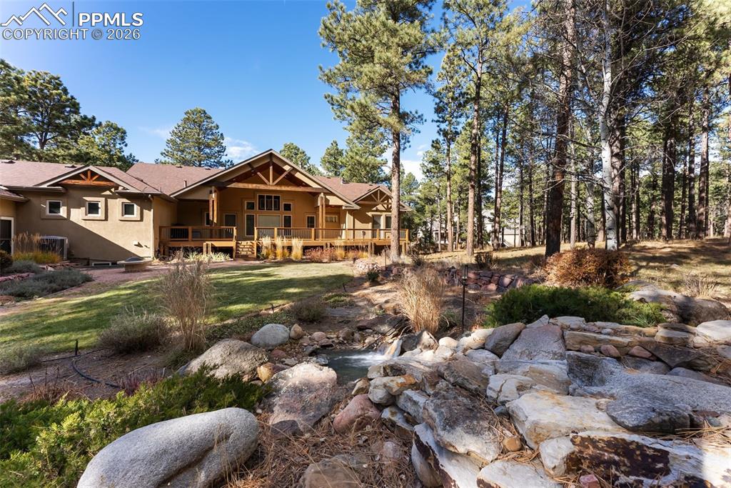 Rear view of the home from the water fall feature.
