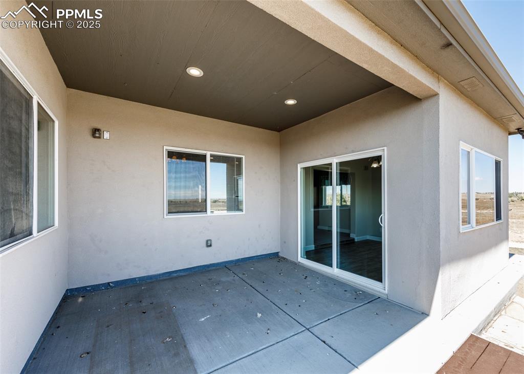 Covered concrete patio.