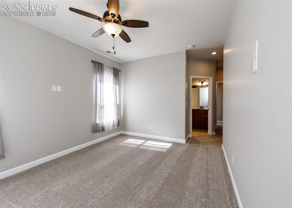 Another view of the primary bedroom looking into the bath.