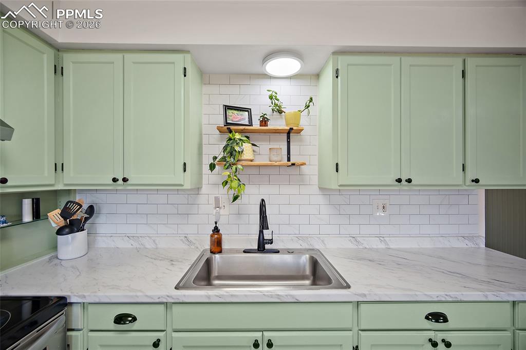 Updated kitchen with beautiful backsplash.