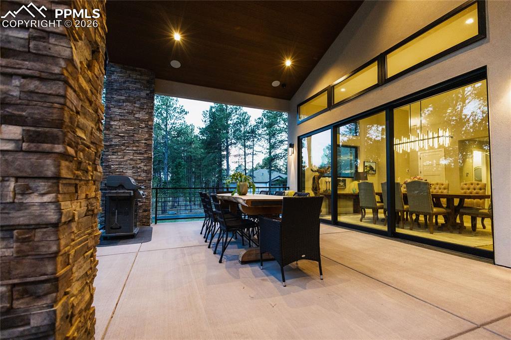 View of patio featuring outdoor dining area and grilling area