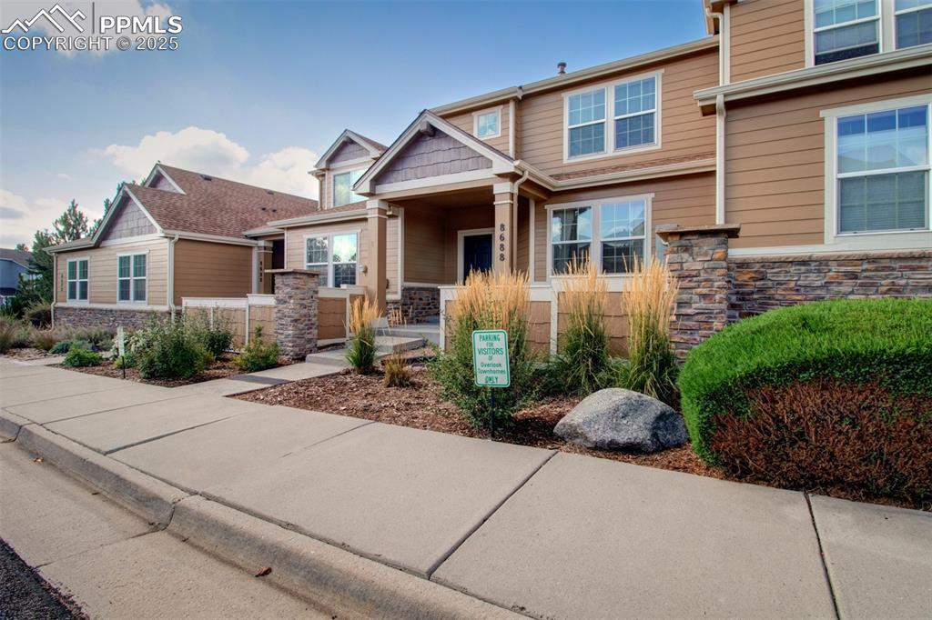 Craftsman-style house featuring stone siding