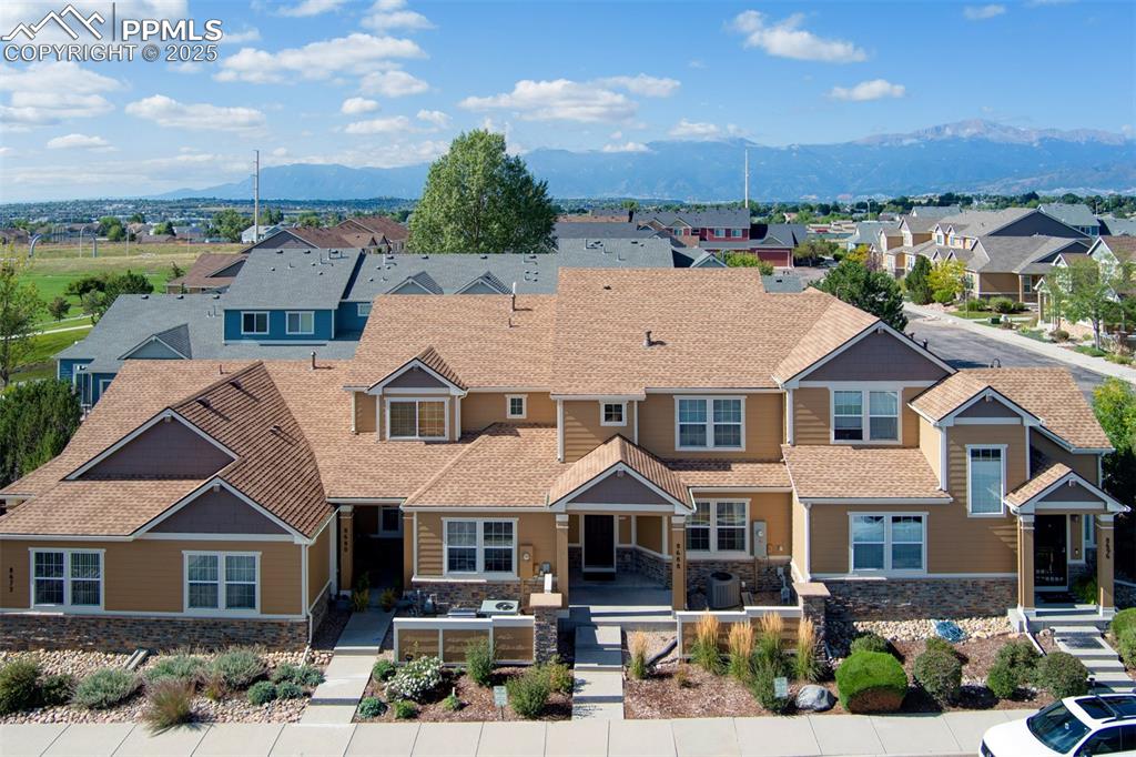 Aerial perspective of suburban area featuring mountains