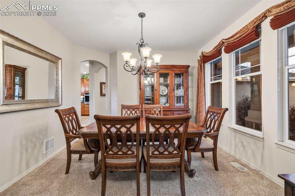 Formal dining room accomodates a large table for holiday gatherings 