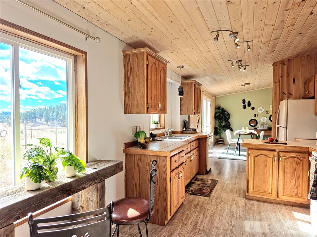 bright natural lighting is a feature of this spacious kitchen