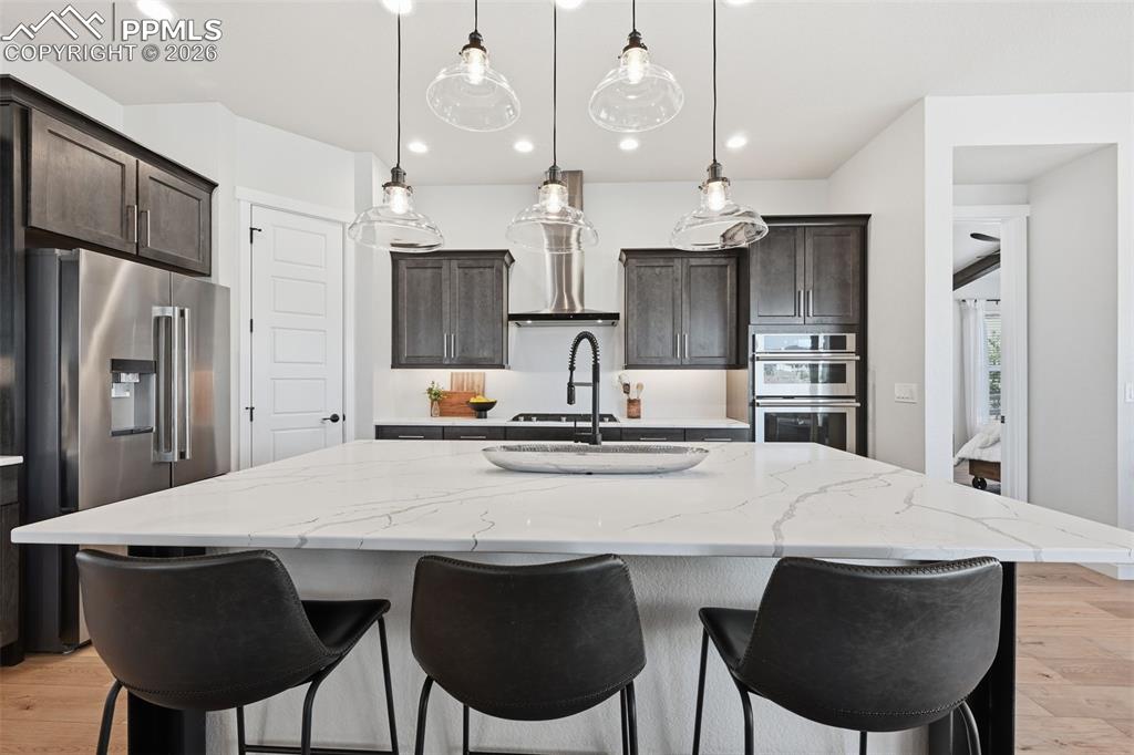 Huge kitchen island with quartz counters