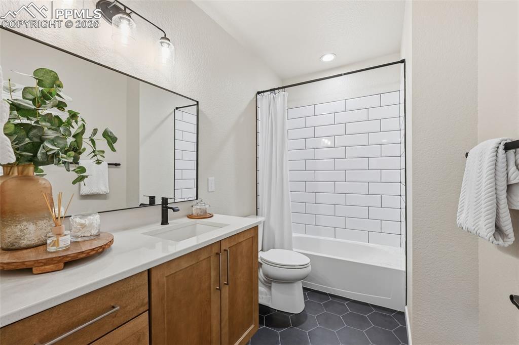 Full bath with upgraded tile, cabinets and countertops