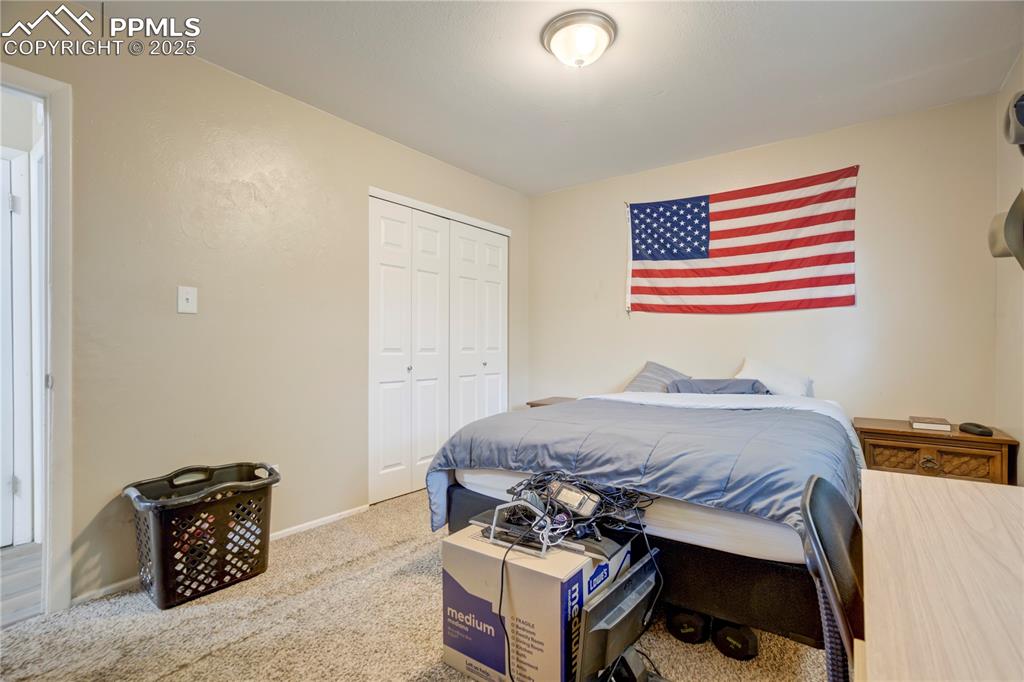 Bedroom with carpet floors and a closet