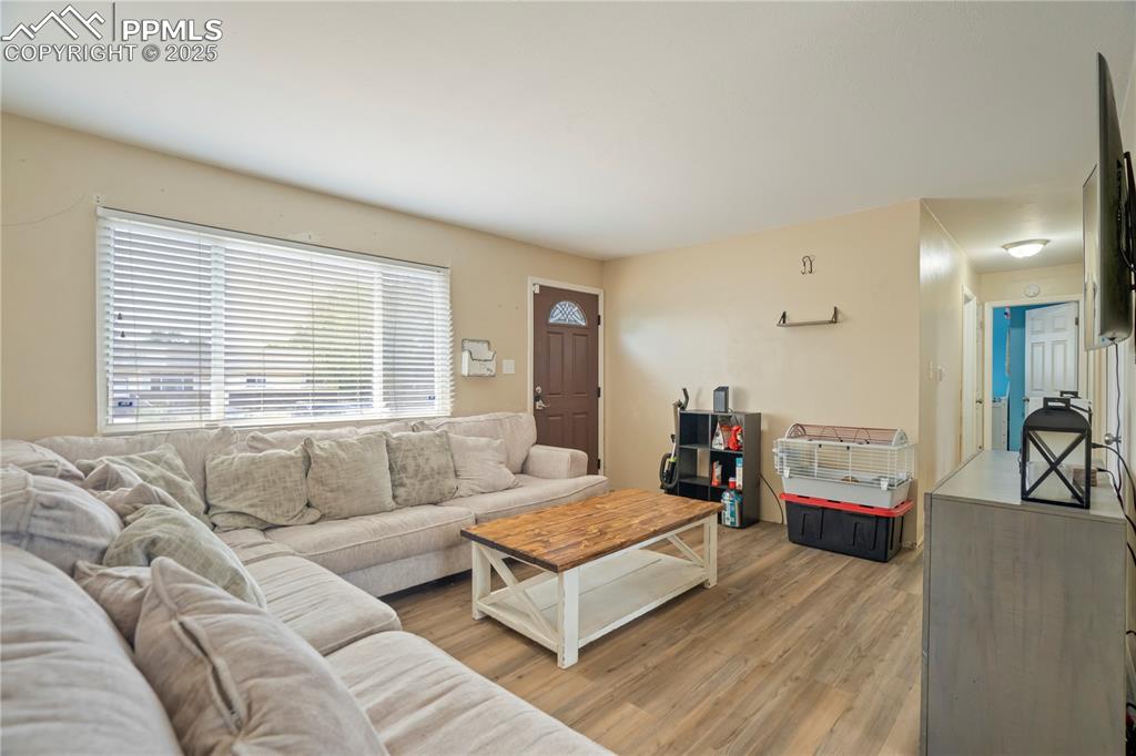 Living area featuring light wood-style flooring