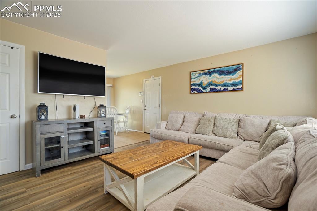 Living room with wood finished floors and baseboards
