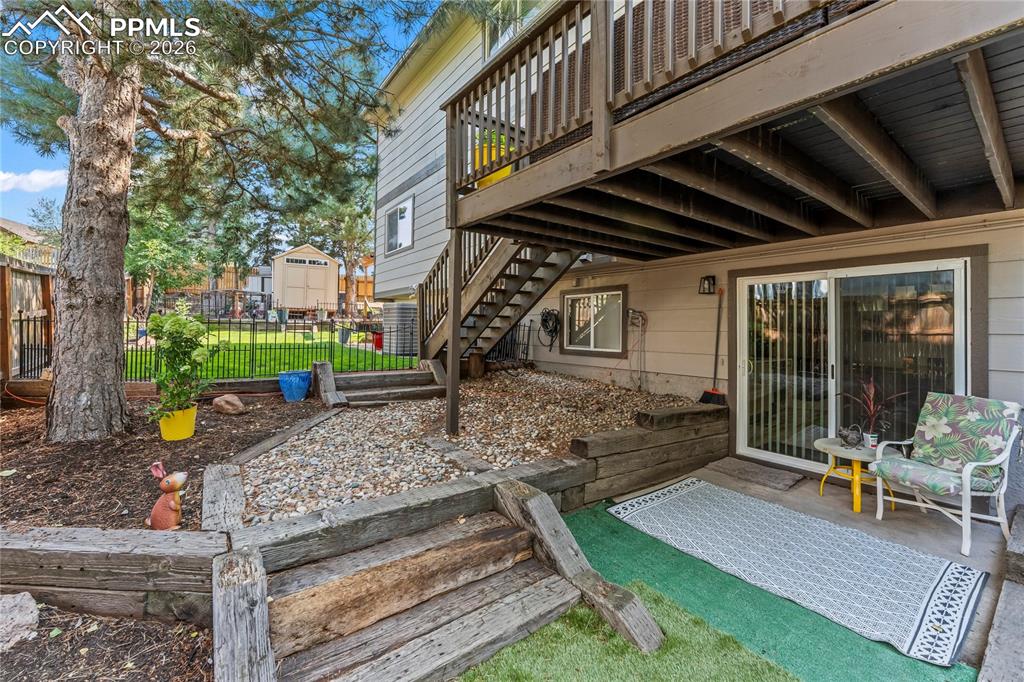 View of patio / terrace featuring stairway and a deck