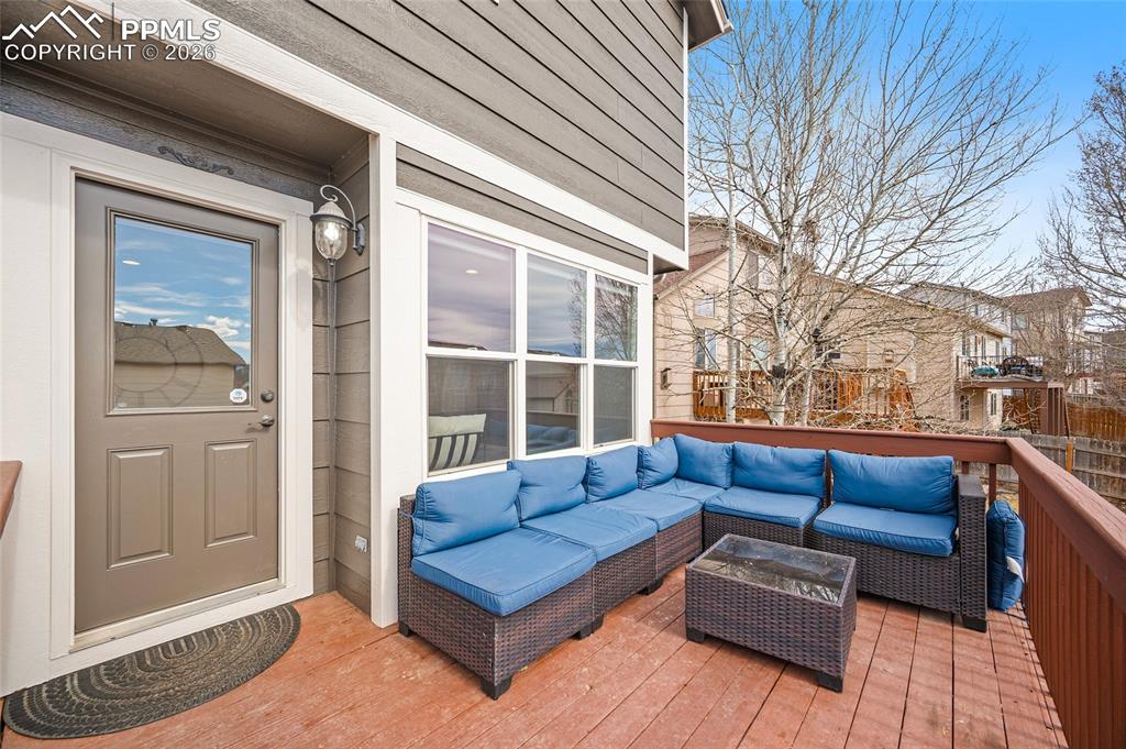 Wooden deck with an outdoor living space