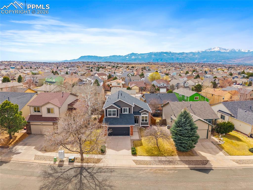 Aerial view of residential area with mountains