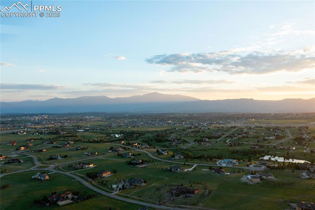 Aerial view of property's location featuring rural landscape and a mountain backdrop
