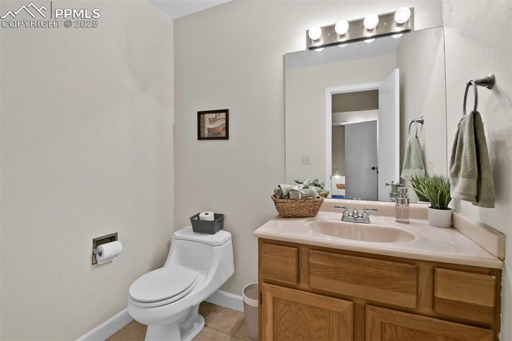 Bathroom featuring vanity and light tile patterned floors