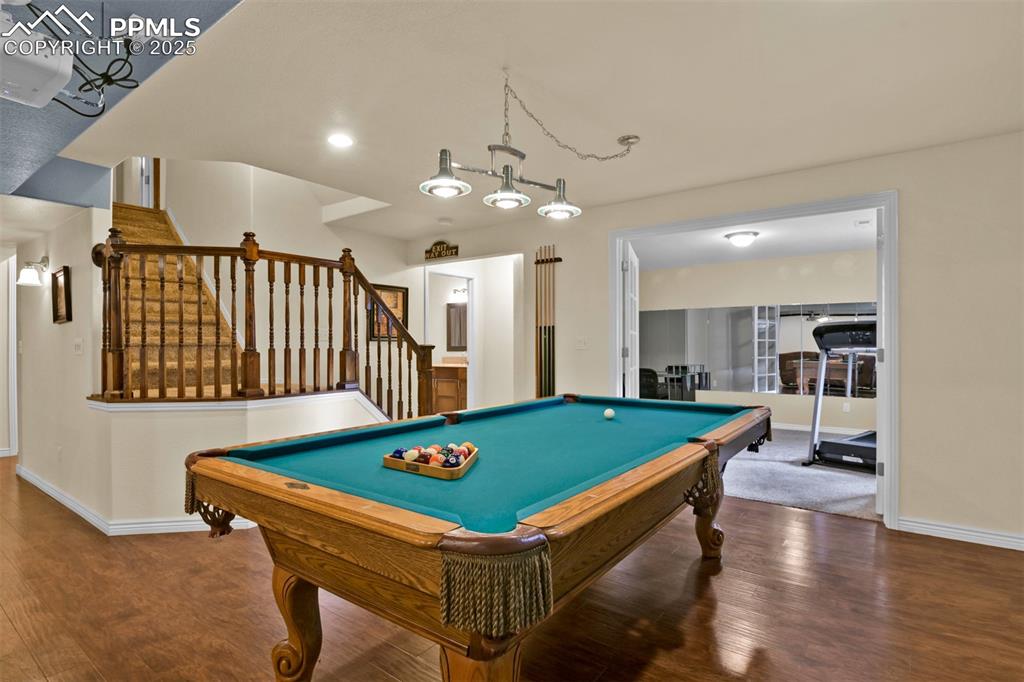 Game room featuring wood finished floors, billiards, and recessed lighting