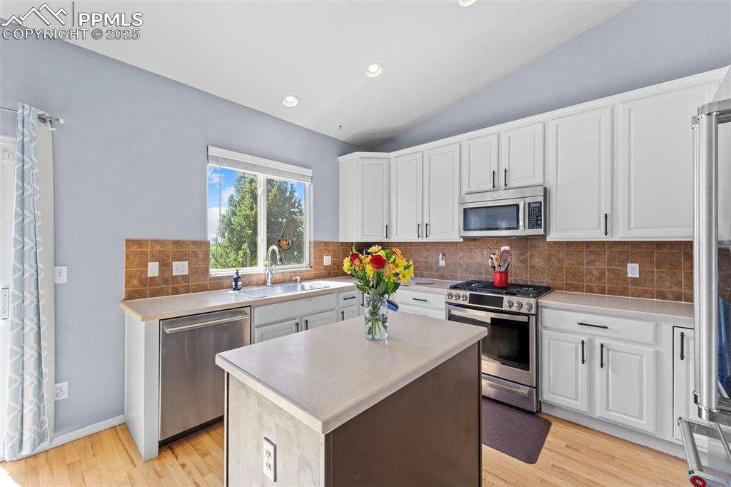 Light-filled kitchen with ample cabinetry

