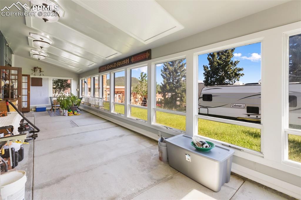 Solarium, looking west to east, floor in concrete to hold heat, notice that you can see the RV parked on the RV space to the south.