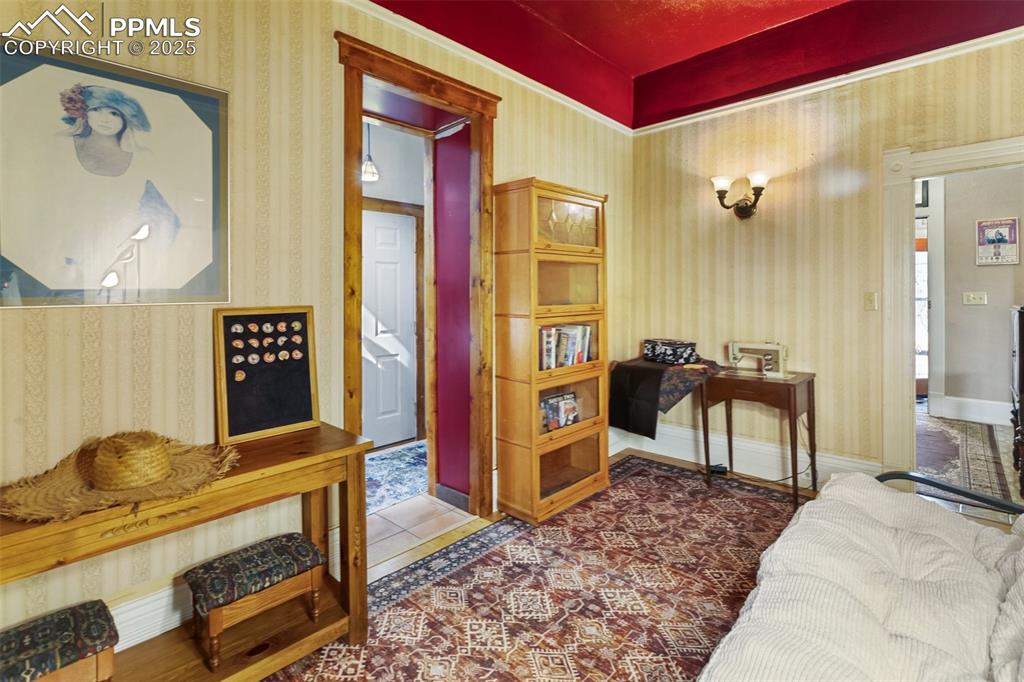 a bedroom, egress through a window in the door to the Foyer, and by the door to hallway which exits to third street. There is also access to garage from the hallway