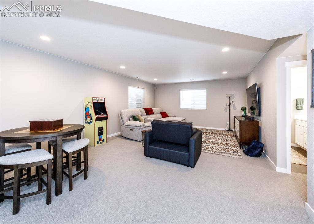 Bright and roomy basement family room offers plenty of space for family activities, a home theater, or game area.