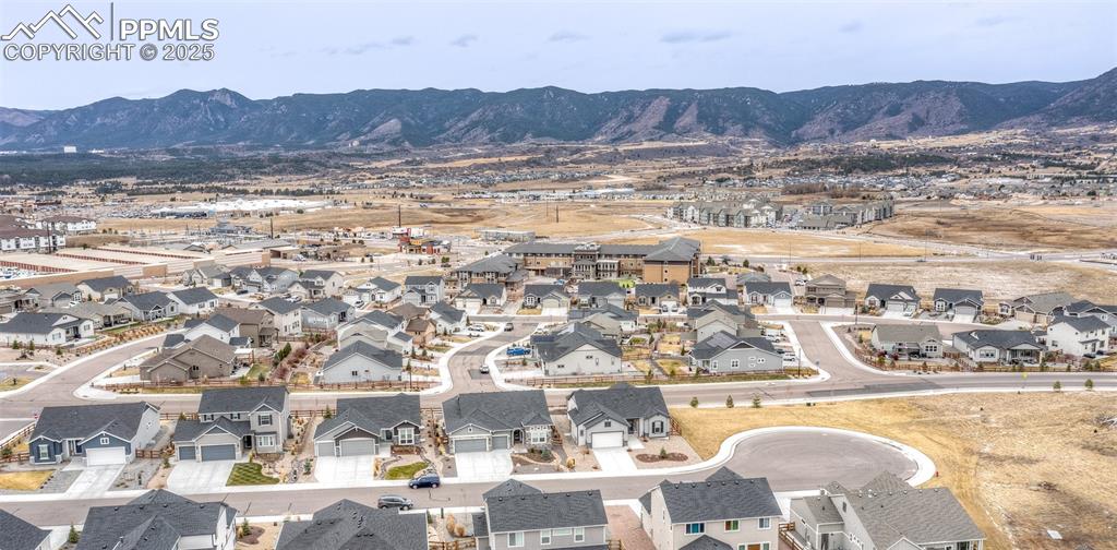 Aerial view of residential area with mountains