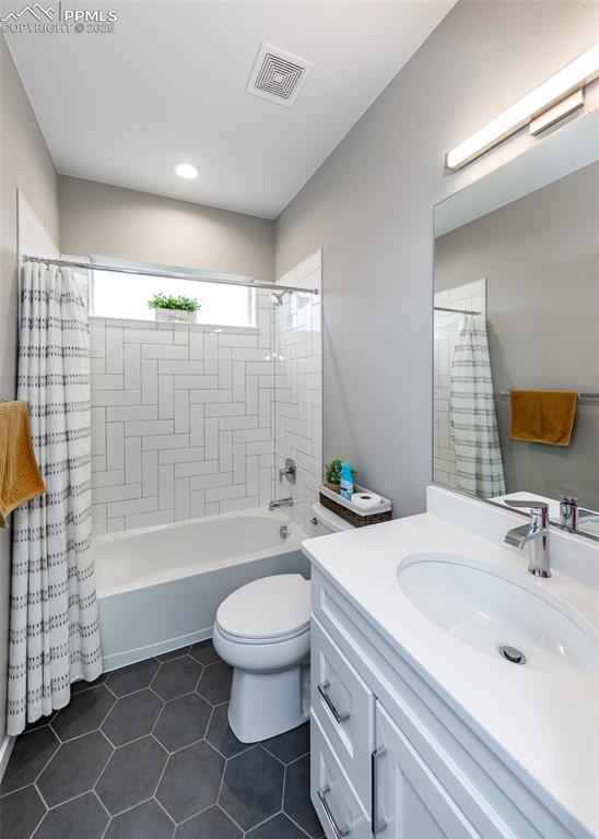 Full bathroom with vanity and tub/shower