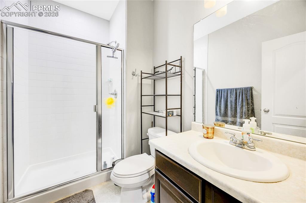 Bathroom with vanity and a stall shower