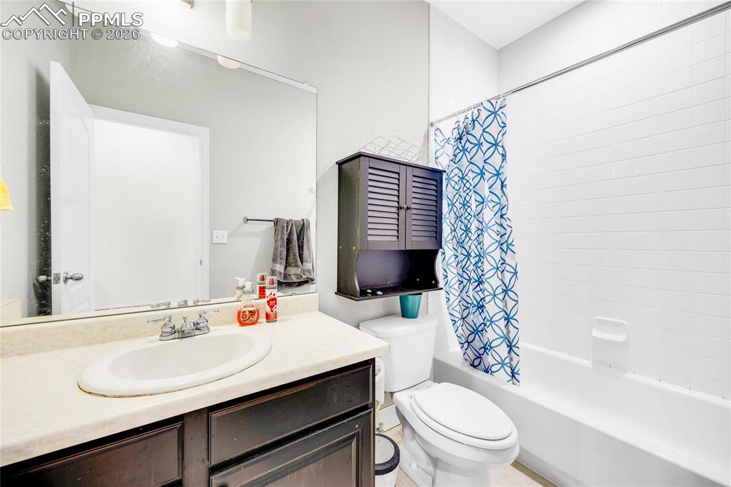 Bathroom featuring vanity and shower / bath combo