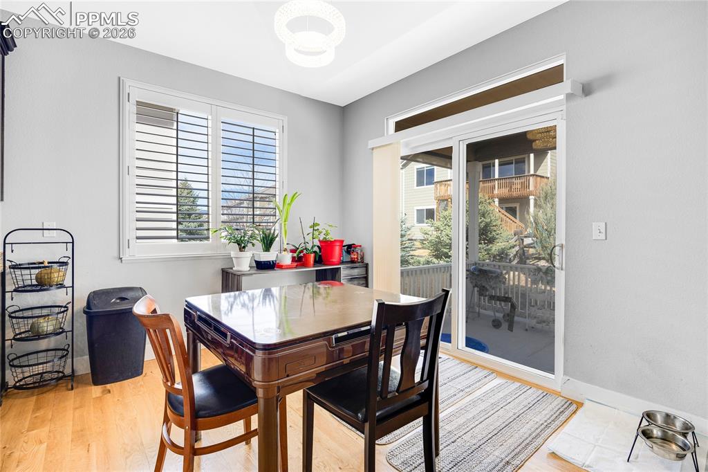 Dining area with healthy amount of natural light and light wood-type flooring