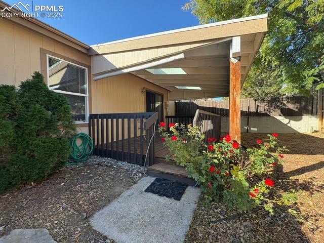Entrance to property with a wooden deck