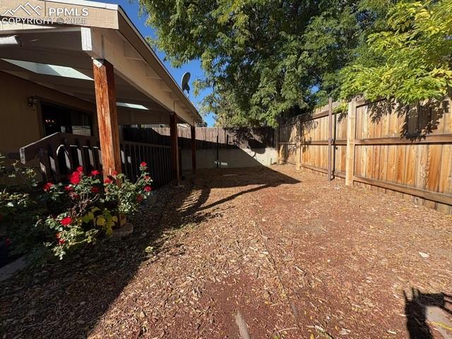View of fenced backyard