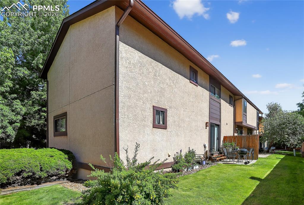 View of property exterior featuring stucco siding, and a patio