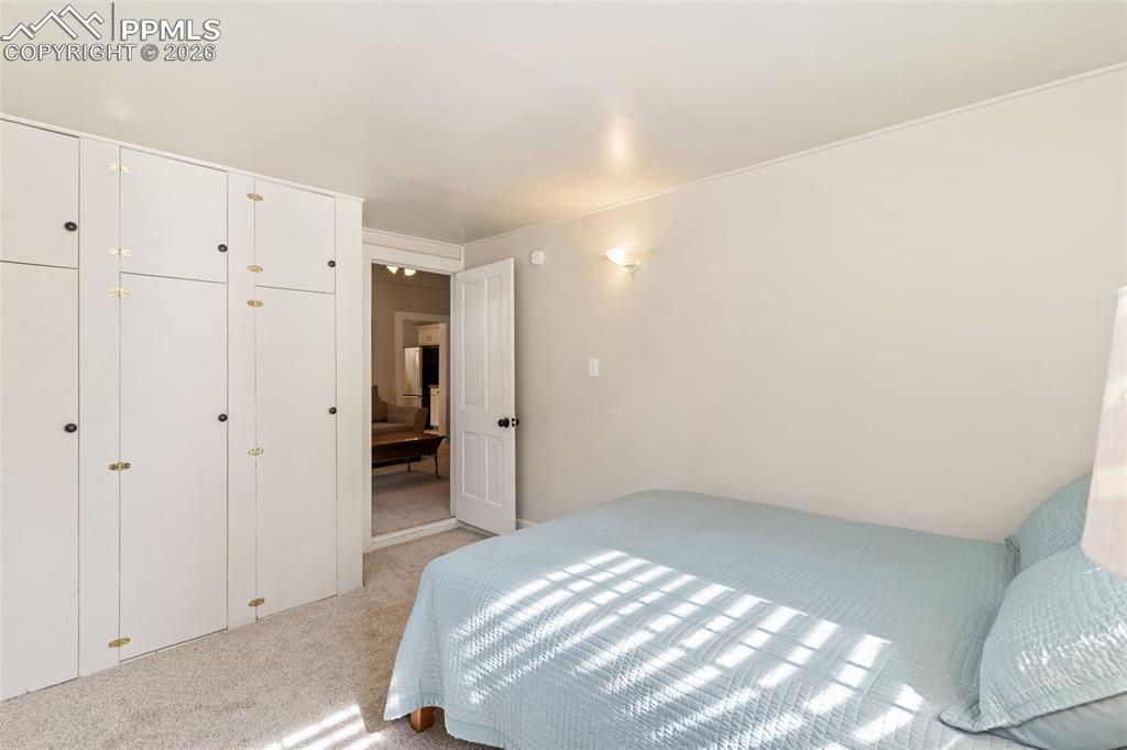 Second bedroom is bathed in natural light, and has built in closets.