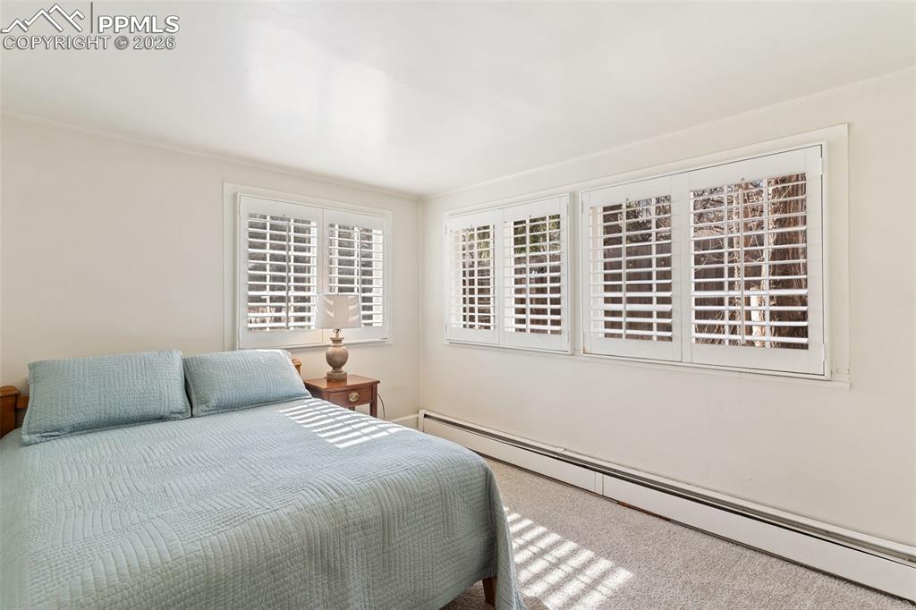 Second bedroom is bathed in natural light, and has built in closets.