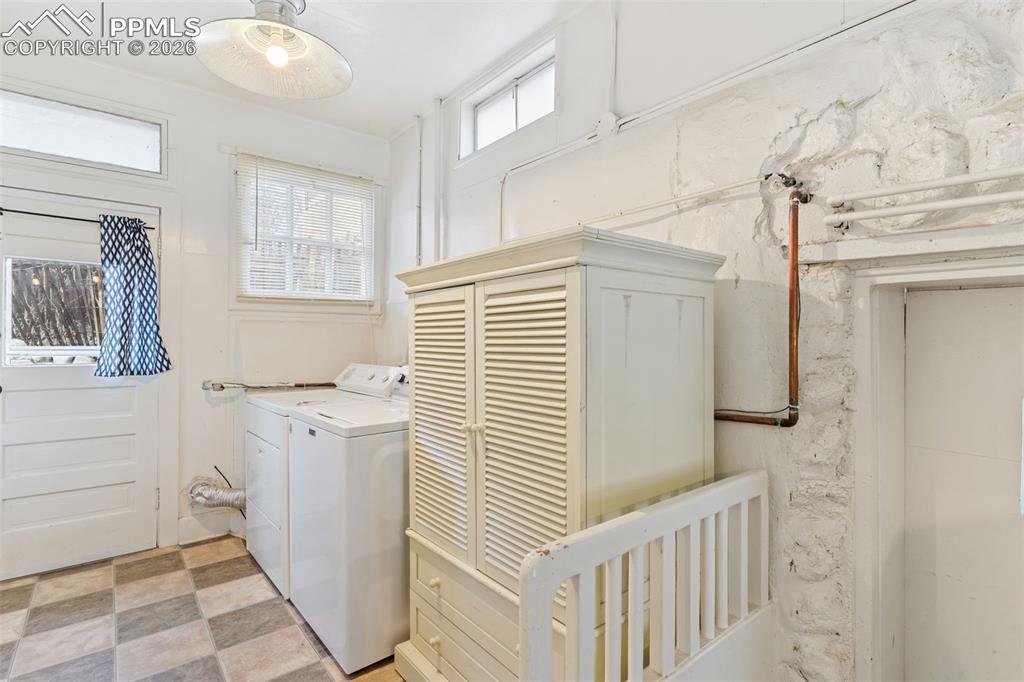 Laundry is right off the kitchen and has a lot of natural light; door to outside patio on the side of the house.