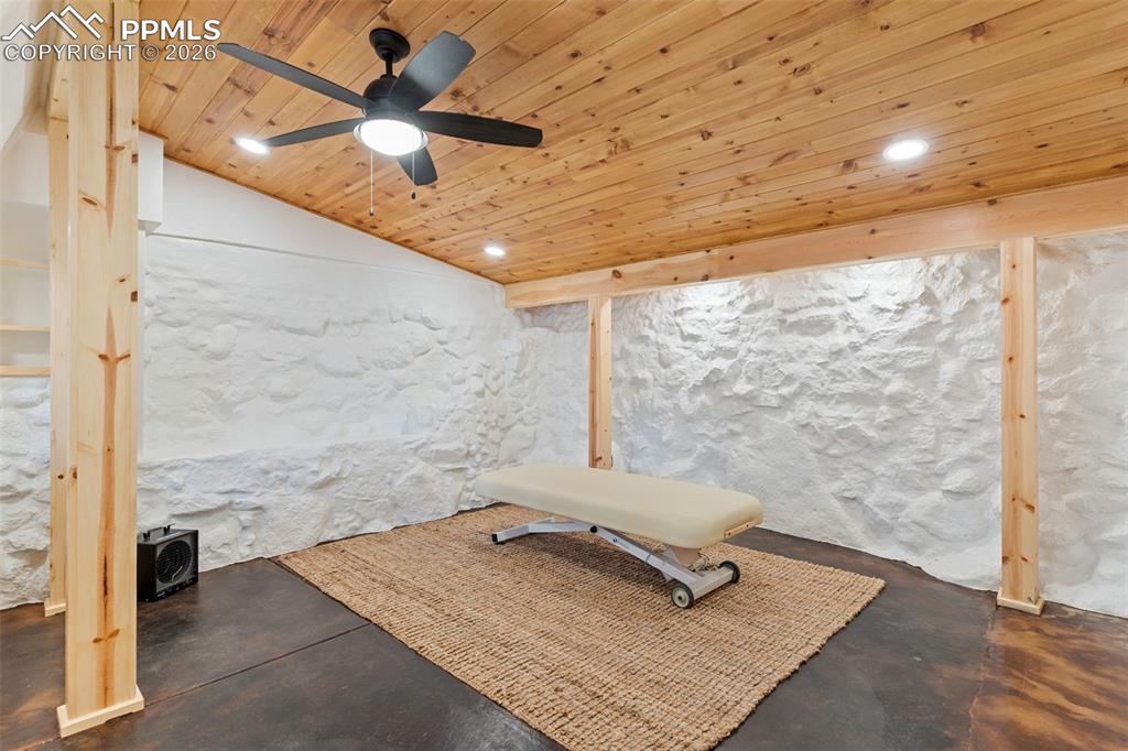Custom studio is perfect for a home office, business, art room, workshop, etc. Tongue and groove wood ceiling, recessed lighting, beautiful wood accents, stained concrete floor--just beautiful!