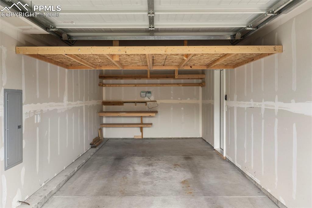 Garage featuring electric panel