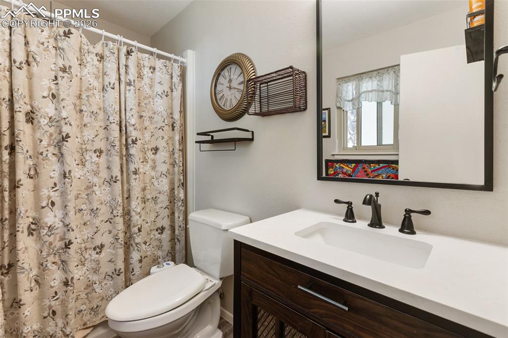Bathroom featuring vanity and a shower with curtain