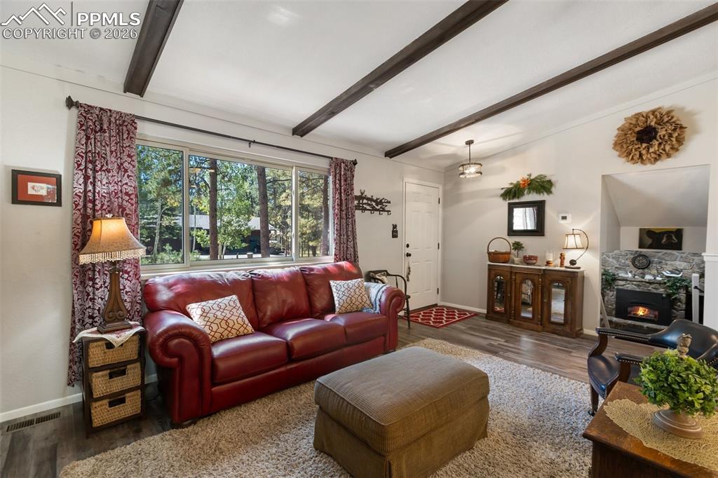 Living room featuring wood finished floors and baseboards