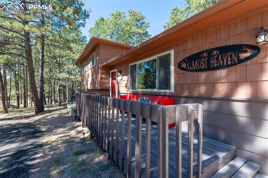 View of home's exterior featuring a wooden deck