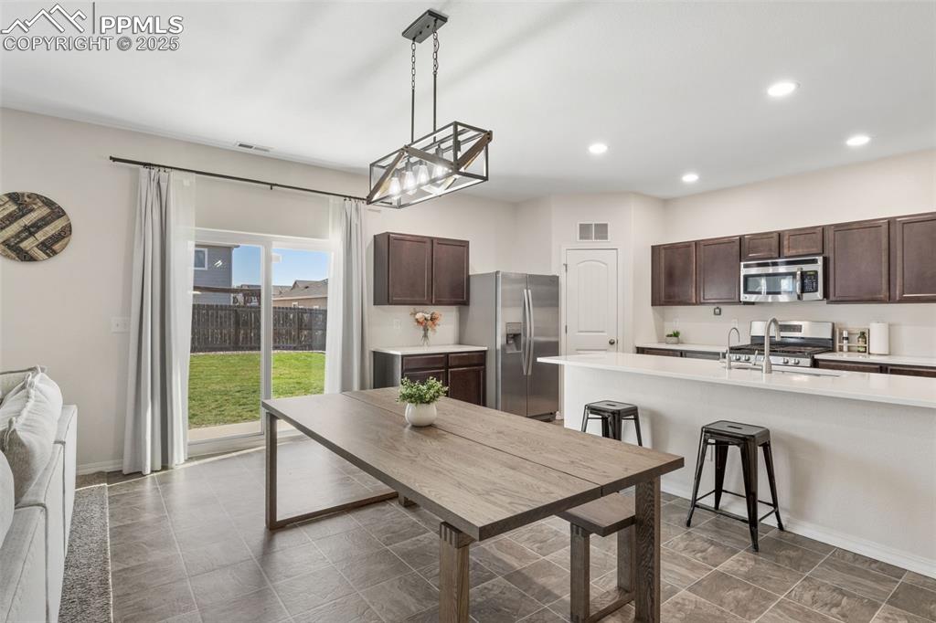 Dining room featuring recessed lighting and baseboards