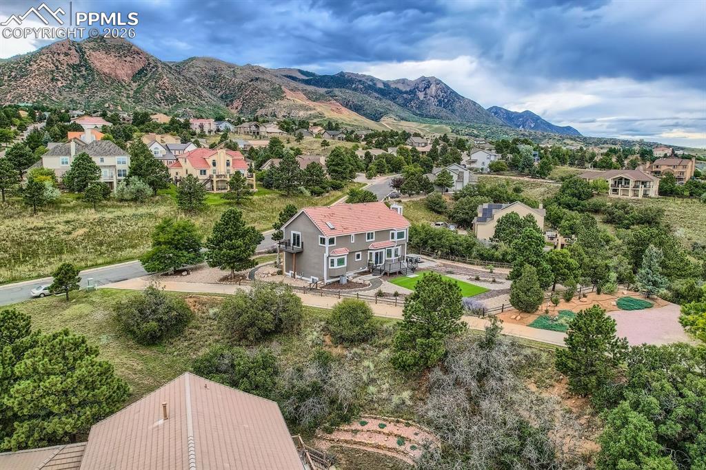 Aerial view of residential area featuring mountains